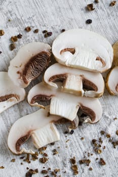 Mushrooms fungus on the white table, spaghetti and species. Ingredients for spaghetti.