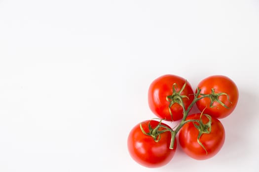 Red four tomatoes on the white background, vegetable