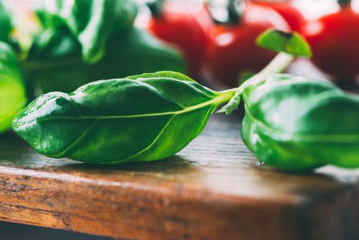 Close up of fresh basilic leaves on cutting board