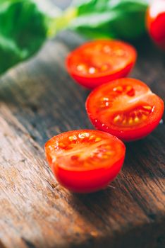 Close up sliced cherry tomatoes on cutting board