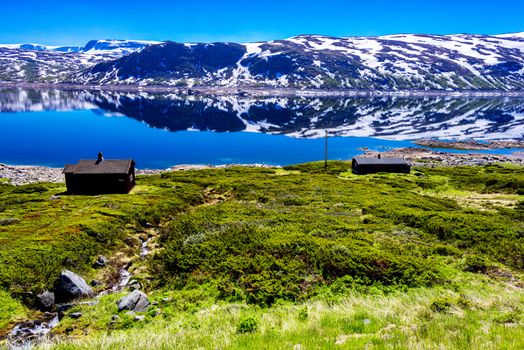 Scenic view on Norwegian landscape with snow mountains at summer