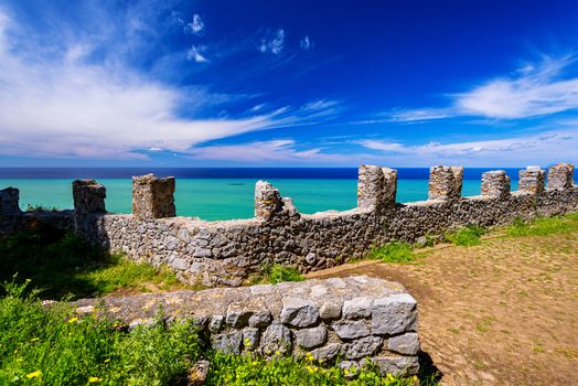 Ruins of ancient castle on the top of Cefalu Rock, large massif in Cefalu city on the shore of Tyrrhenian Sea on Sicily Island in Italy