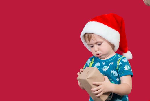 Little boy with Christmas gift.Merry Christmas and Happy New Year, winter holiday concept