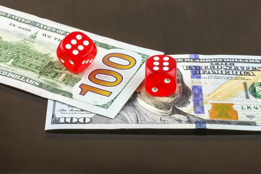 Two red dice poker on banknotes