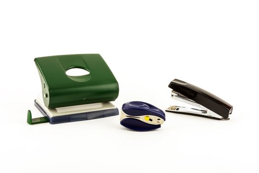 Stationery - Stapler, anti-stapler and puncher on a light background