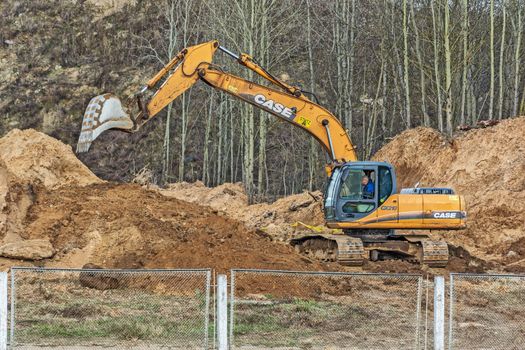 Excavator is digging a trench