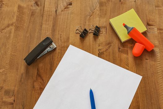 On the table are different office supplies