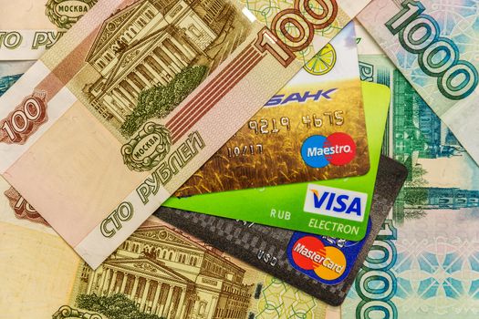 Money bills and bank cards Maestro, VISA and MasterCard