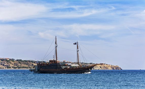 Greece, Crete, Ierapetra - 10/05/2015: Tourist ship sails along the coast