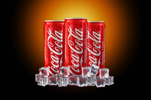 Kuala Lumpur, Malaysia - October 19, 2020 : Coca Cola or Coke Drink on yellow gradient light and black background