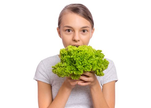 Beautiful young teen girl holding holding green salad, isolated on white background