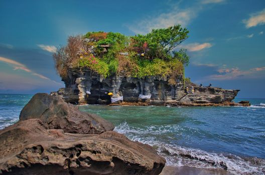 The image is a temple in Bali This is floating temple in Ta nah Lot