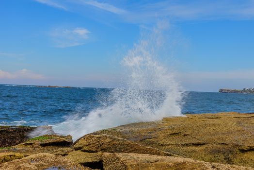 The Image was captured while wave hit rocky surface