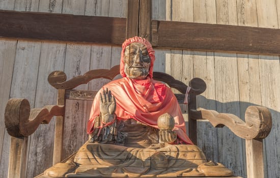 Wooden statue of lord Buddha