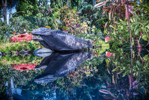 Coloful plants and boat in the indoor garden