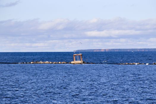 Baltic sea seascape, blue horizon, clouds and boats in Tallinn, Estonia.