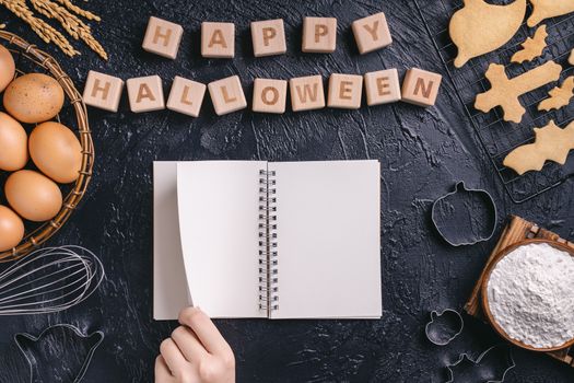 Design concept of top view layout of making Halloween cookies, preparing party, overhead, blank copy space.