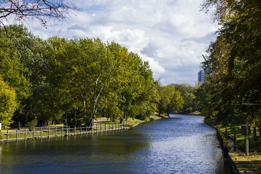 Park in Berlin, water, trees and autumn time, urban recreation. Germany park.