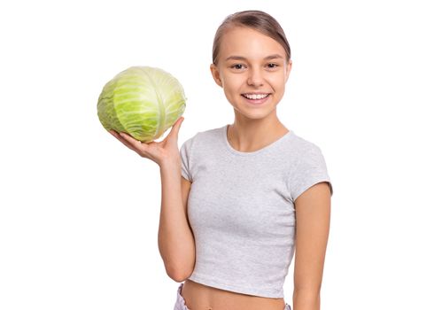 Beautiful young teen girl holding fresh green cabbage, isolated on white background