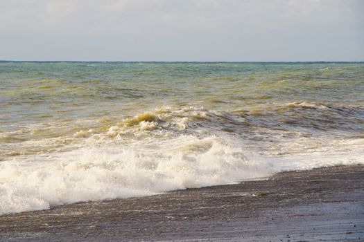 Sea and waves, stormy weather, waves and splashes in Batumi, Georgia. Stormy Black sea. Water background.