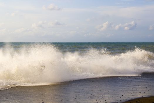 Stormy weather, waves and splashes in Batumi, Georgia. Stormy Black sea. Water background.