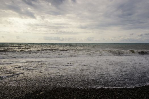 Stormy weather, waves and splashes in Batumi, Georgia. Stormy Black sea. Water background.