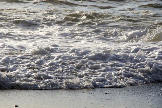 Stormy weather, waves and splashes in Batumi, Georgia. Stormy Black sea. Water background.