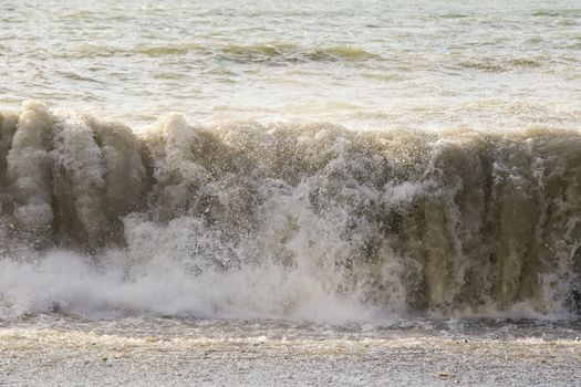 Stormy weather, waves and splashes in Batumi, Georgia. Stormy Black sea. Water background.