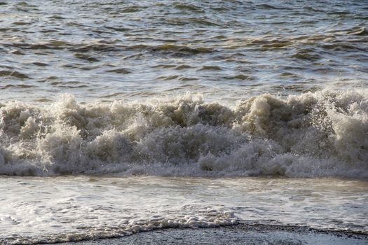 Stormy weather, waves and splashes in Batumi, Georgia. Stormy Black sea. Water background.