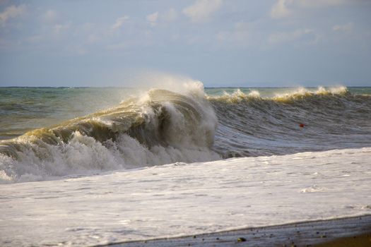 Stormy weather, waves and splashes in Batumi, Georgia. Stormy Black sea. Water background.