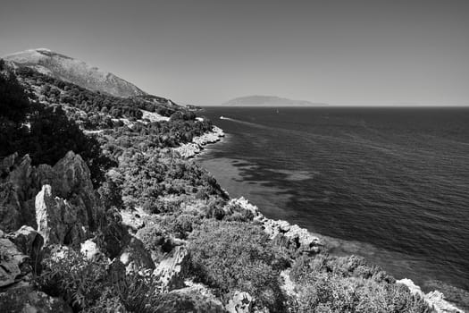 rocky coast of the Ionian Sea on the island of Kefalonia in Greece, monochrome