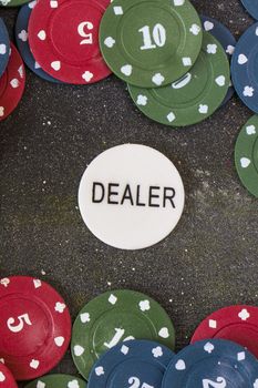 Card dealer chips on the poker and blackjack table, play cards