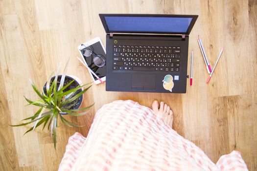 Woman working from home office, notebook or laptop, pencil and other things. Business working process, desktop and keyboard. high angle view.