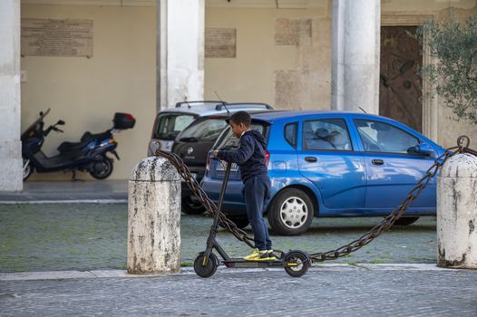 terni,italy october 21 2020:black child going with mono skate