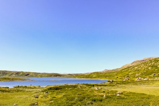 Beautiful Vavatn lake and mountains in the summertime in Hemsedal, Buskeud, Norway.