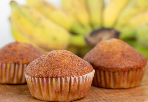 Homemade banana cakes on a wooden background.