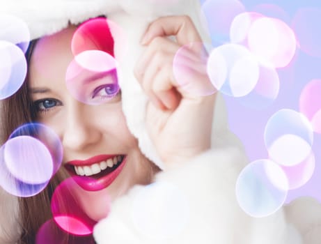 Merry Christmas portrait of smiling young woman wearing fluffy white fur coat, luxury beauty and happy holidays