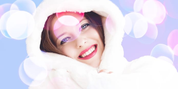 Merry Christmas portrait of smiling young woman wearing fluffy white fur coat, luxury beauty and happy holidays