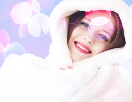 Merry Christmas portrait of smiling young woman wearing fluffy white fur coat, luxury beauty and happy holidays