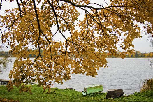 Old wooden boats near the beach of Trakai Gavle lake lake, Lithuania. Autumn and fall time.