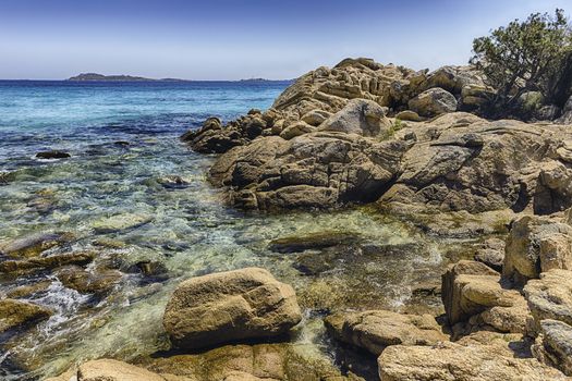 View over the enchanting beach of Capriccioli, one of the most beautiful seaside places in Costa Smeralda, northern Sardinia, Italy