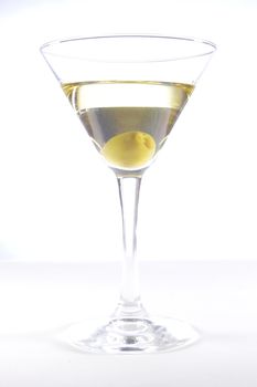 Glass with martini and olive on a white background