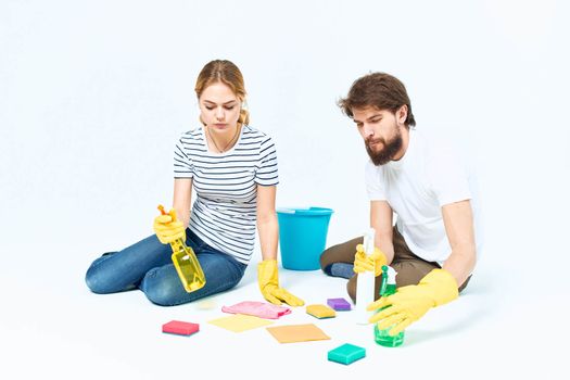 Man and woman detergent lifestyle cleaning teamwork. High quality photo