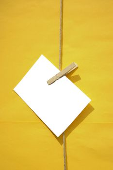 white blank reminder note on yellow background