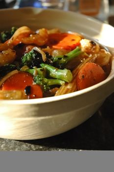 Chinese vegetable stir-fried in hot pot on rice with black bean sauce