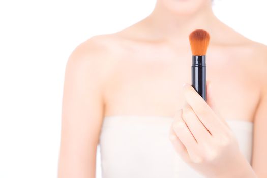 Beauty asian woman applying make up with brush of cheek isolated on white background, beautiful of girl holding blusher, skincare and cosmetic concept.