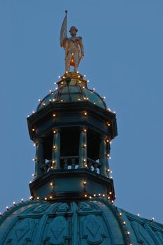 golden european statue on the dome