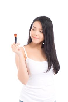 Beauty asian woman applying make up with brush of cheek isolated on white background, beautiful of girl holding blusher, skincare and cosmetic concept.