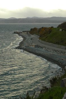 winding road nearby ocean in evening