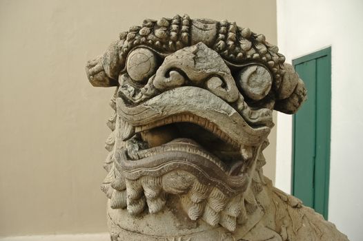 Ancient Chinese stone lion carved by hand